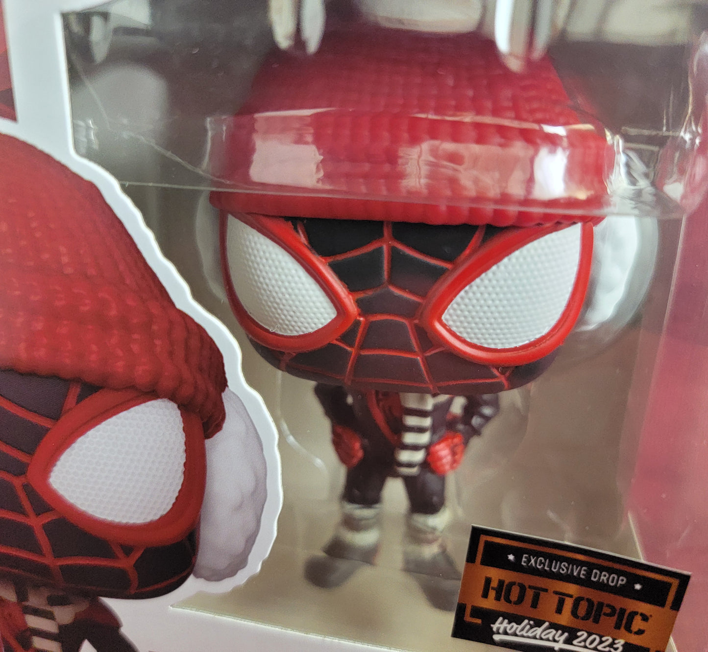 Miles Morales winter hot topic exclusive  funko # 1294 (nib) 
With pop protector