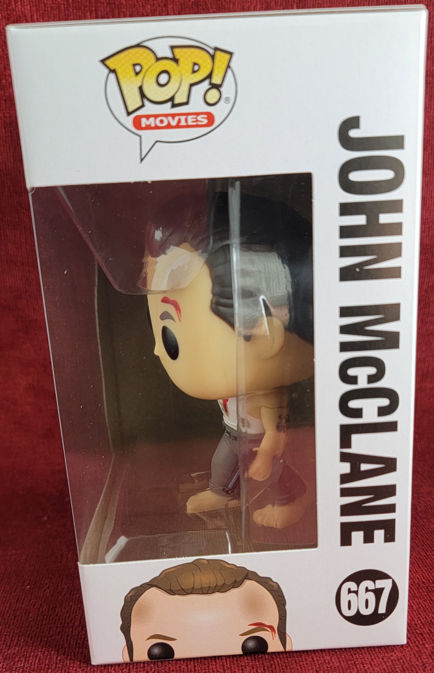 John McClane funko # 667 (nib)
With pop protector